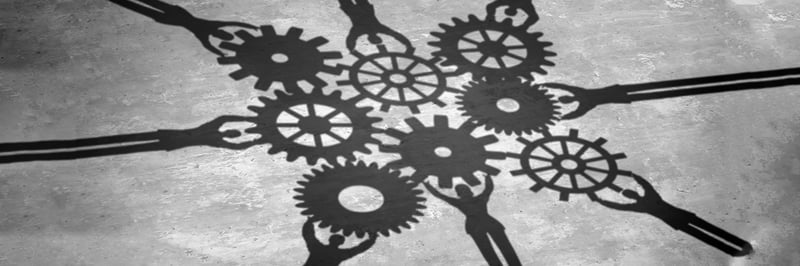 The Strategic Alliances of Nonprofits | coworkers with gears