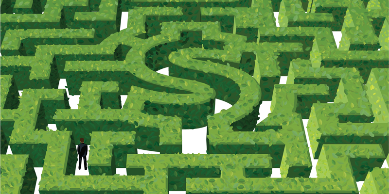 businessperson navigating Money-Shaped maze